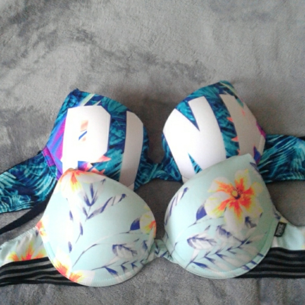 Two pink Victorious Secret bras both floral patter